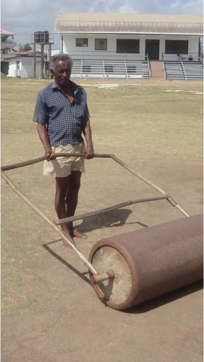 Paul Singh rolling the cricket pitch